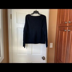 Ladies black sweater with zippers.